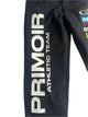Close-up of left pant leg from Primoir USA+ tracksuit featuring bold vertical 'PRIMOIR ATHLETIC TEAM' graphic on black fabric.